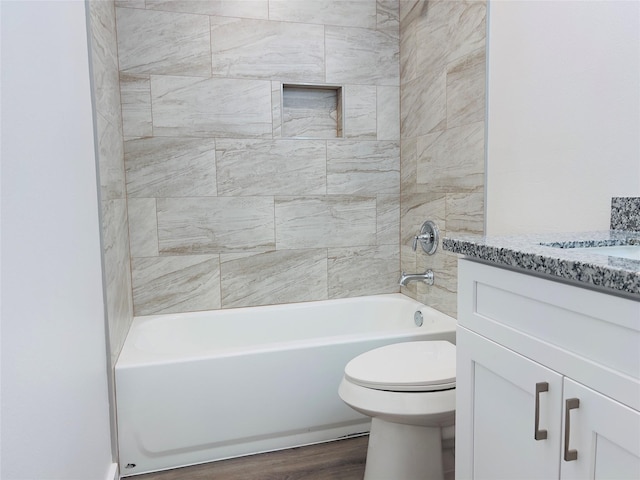 5618 Grace Point Ln, Houston, TX 77048 - bathroom featuring wood finished floors, shower / bathing tub combination, toilet, and vanity