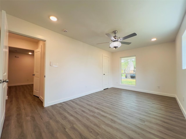 5618 Grace Point Ln, Houston, TX 77048 - spare room featuring dark wood-type flooring, ceiling fan, recessed lighting, and baseboards