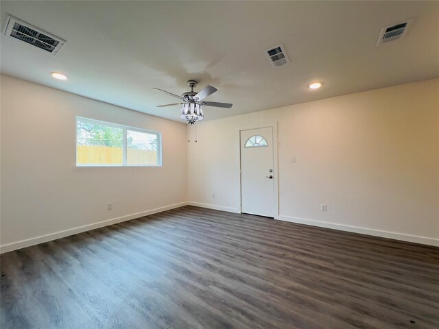 5618 Grace Point Ln, Houston, TX 77048 - unfurnished room featuring dark wood-type flooring, visible vents, and baseboards