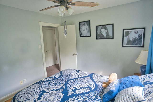 bedroom featuring baseboards, ceiling fan, and carpet floors