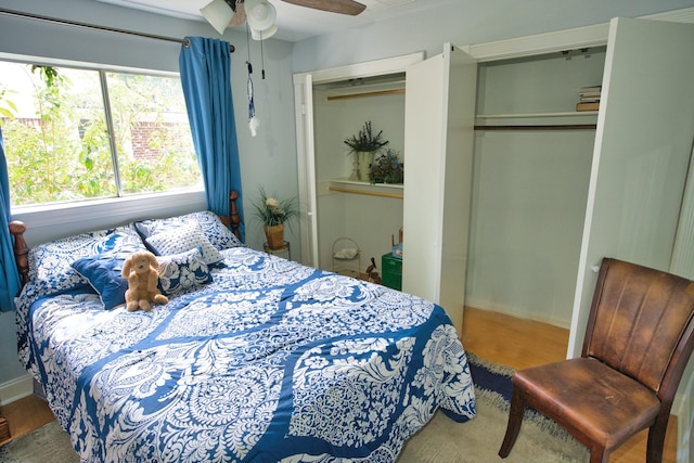 bedroom featuring wood finished floors, ceiling fan, and baseboards