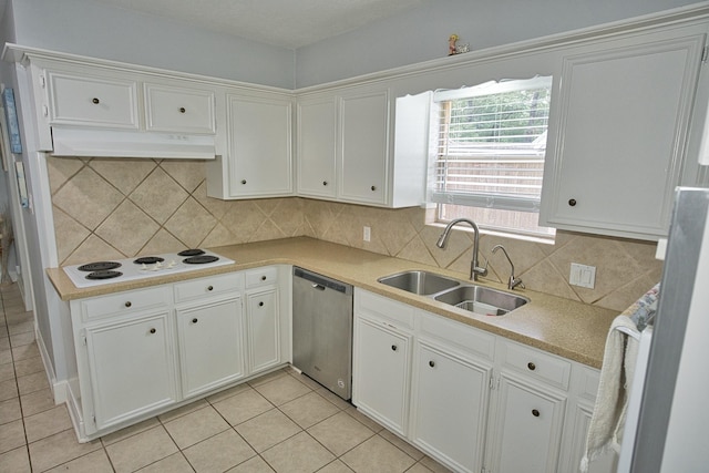 kitchen with white electric stovetop, stainless steel dishwasher, light tile patterned floors, under cabinet range hood, and a sink