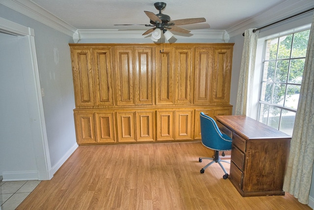 unfurnished office with ornamental molding, ceiling fan, light wood-style flooring, and baseboards