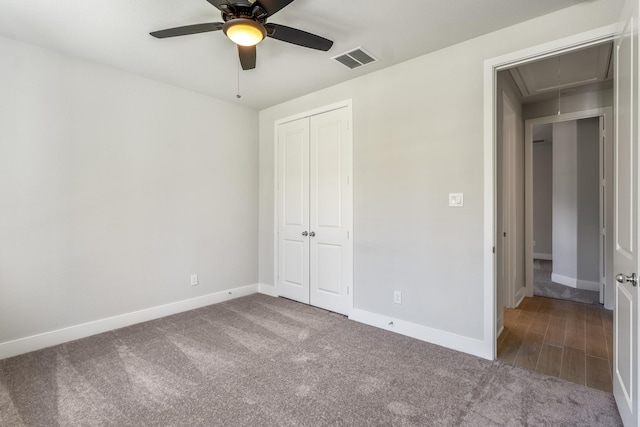 17311 Sunflower Petals Trl, Conroe, TX 77302 - unfurnished bedroom with carpet floors, attic access, visible vents, and a closet
