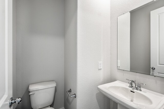 17311 Sunflower Petals Trl, Conroe, TX 77302 - half bathroom with toilet and a sink