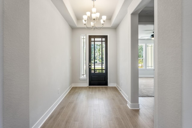 17311 Sunflower Petals Trl, Conroe, TX 77302 - foyer entrance with a chandelier, baseboards, wood finished floors, and plenty of natural light