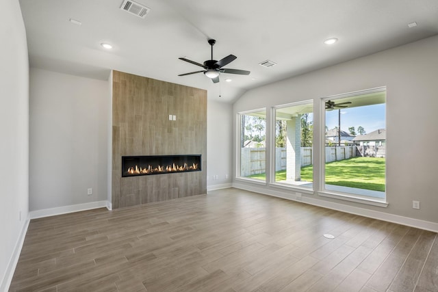 17311 Sunflower Petals Trl, Conroe, TX 77302 - unfurnished living room with visible vents, ceiling fan, and baseboards