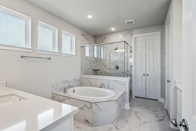 17311 Sunflower Petals Trl, Conroe, TX 77302 - full bath featuring recessed lighting, a bath, a marble finish shower, marble finish floor, and visible vents
