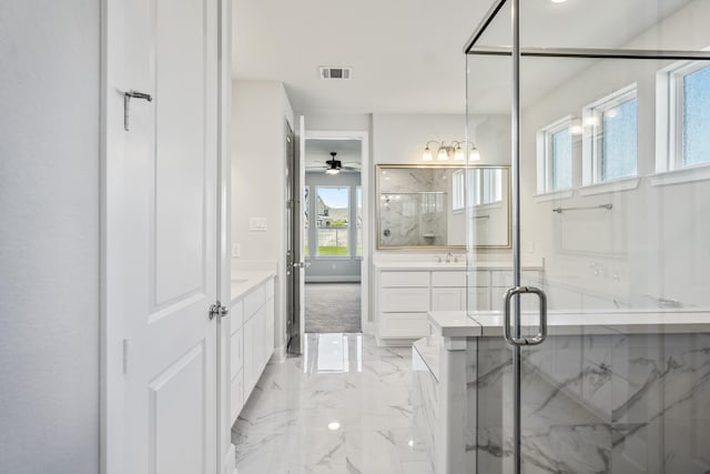 17311 Sunflower Petals Trl, Conroe, TX 77302 - full bath featuring visible vents, a marble finish shower, vanity, marble finish floor, and ceiling fan with notable chandelier