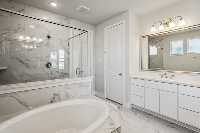 17311 Sunflower Petals Trl, Conroe, TX 77302 - full bathroom featuring vanity, a bathtub, a marble finish shower, marble finish floor, and visible vents