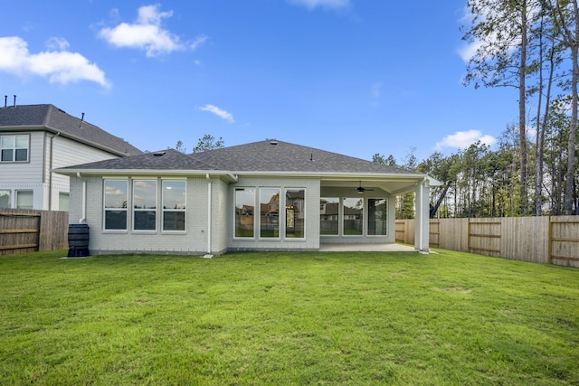 17311 Sunflower Petals Trl, Conroe, TX 77302 - back of property with a patio area, a shingled roof, ceiling fan, a yard, and a fenced backyard