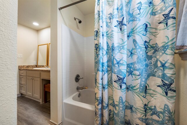 736 County Road 478, Lott, TX 76656 - full bath with vanity, wood finished floors, and shower / bath combination with curtain