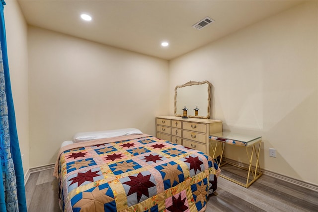 736 County Road 478, Lott, TX 76656 - bedroom with recessed lighting, visible vents, and wood finished floors