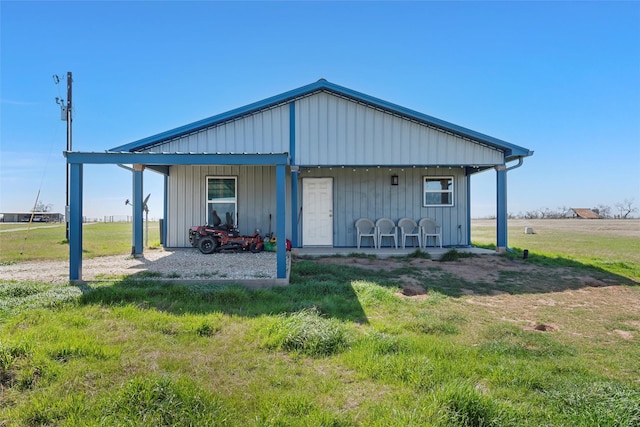 736 County Road 478, Lott, TX 76656 - exterior space featuring a lawn, board and batten siding, and covered porch