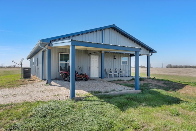 736 County Road 478, Lott, TX 76656 - back of property featuring central AC unit and board and batten siding