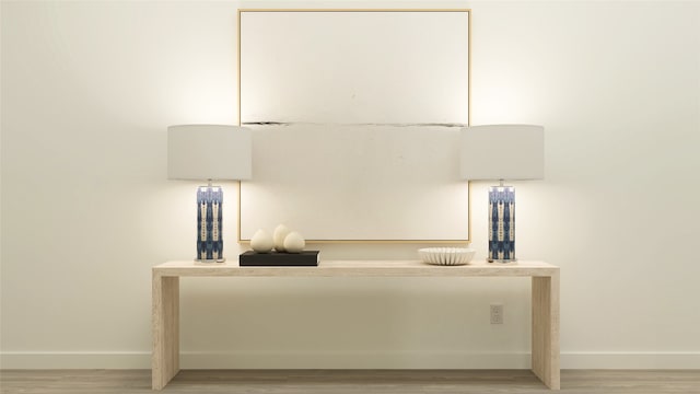 interior details featuring wood finished floors and baseboards