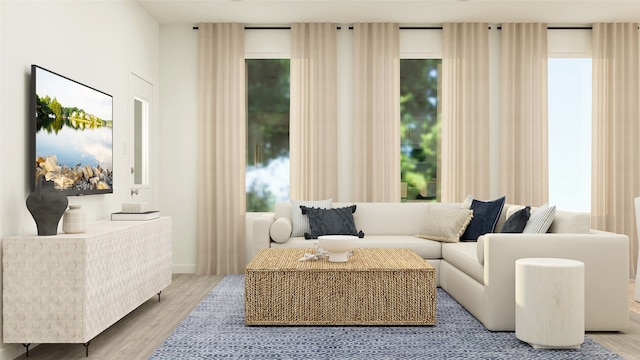 sitting room with a wealth of natural light and wood finished floors