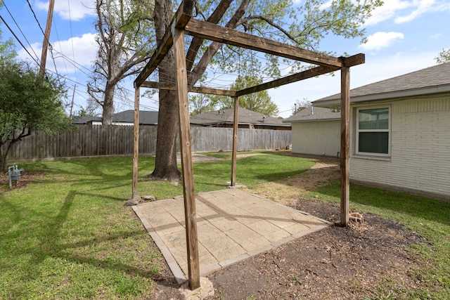 view of yard featuring a patio area and a fenced backyard