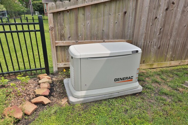 exterior details featuring a power unit and fence