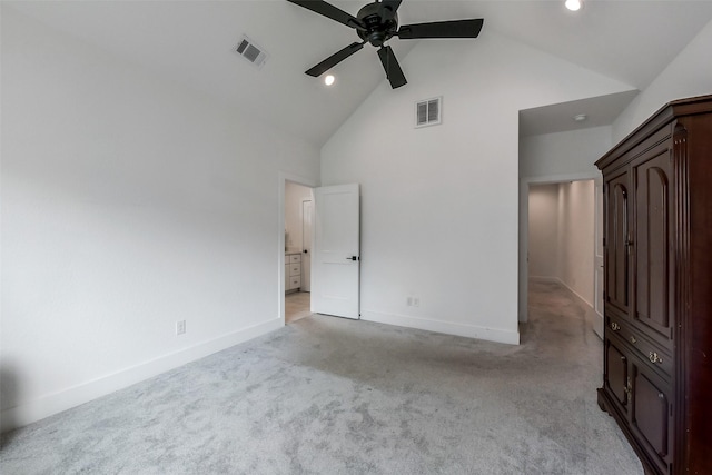 unfurnished bedroom featuring light colored carpet, high vaulted ceiling, visible vents, and baseboards