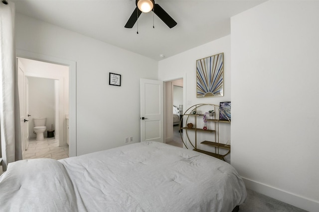 bedroom featuring connected bathroom, ceiling fan, baseboards, and marble finish floor