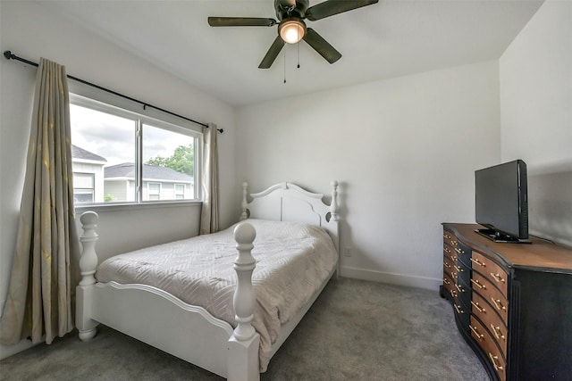 carpeted bedroom with baseboards and ceiling fan