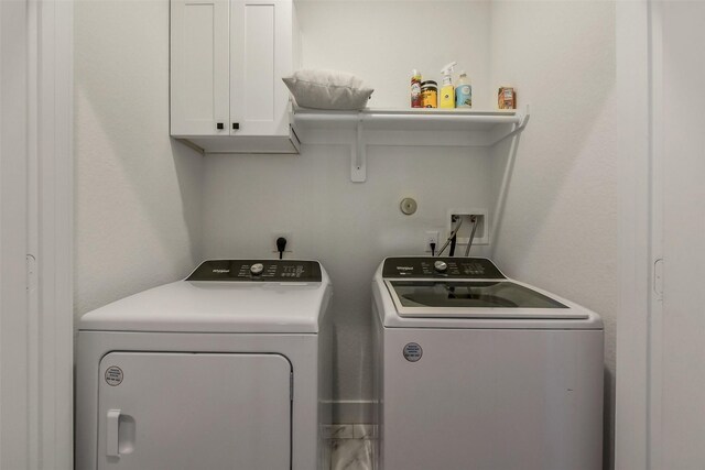 1228 Mcneil St, Houston, TX 77009 - laundry room with cabinet space and separate washer and dryer