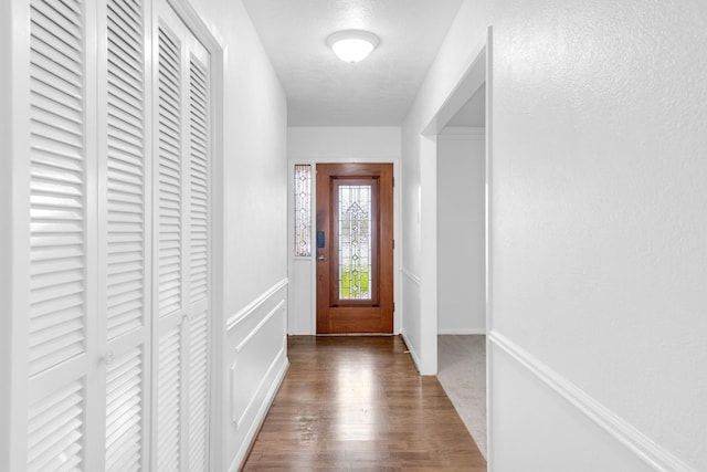 doorway with wood finished floors