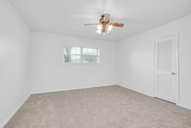 unfurnished bedroom featuring baseboards, a ceiling fan, and carpet floors