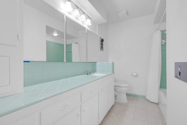 bathroom featuring decorative backsplash, toilet, shower / bathtub combination with curtain, vanity, and tile patterned flooring