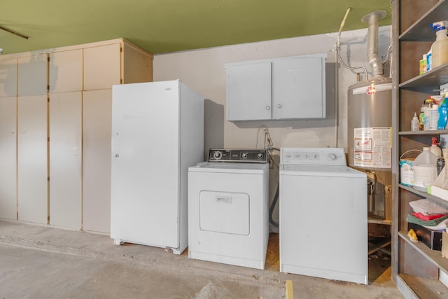 laundry area featuring gas water heater, cabinet space, and washer and clothes dryer