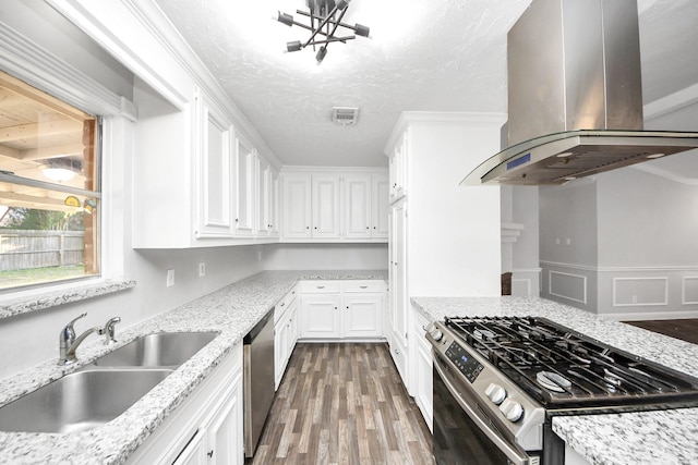 15030 Royal Shadows Dr, Houston, TX 77082 - kitchen featuring a sink, visible vents, stainless steel appliances, dark wood-style flooring, and island exhaust hood