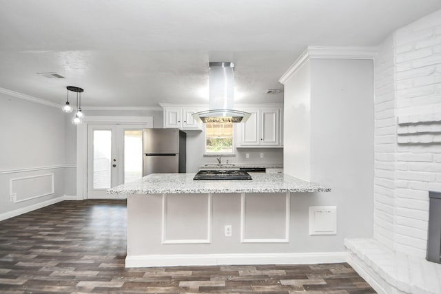 15030 Royal Shadows Dr, Houston, TX 77082 - kitchen with white cabinetry, stainless steel appliances, light stone countertops, dark wood finished floors, and island exhaust hood