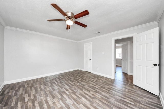 15030 Royal Shadows Dr, Houston, TX 77082 - empty room with visible vents, wood finished floors, ceiling fan, and ornamental molding