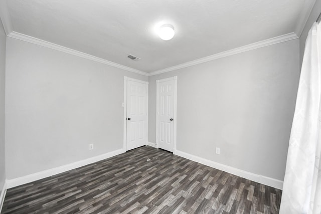 15030 Royal Shadows Dr, Houston, TX 77082 - unfurnished room with baseboards, visible vents, ornamental molding, and dark wood-type flooring