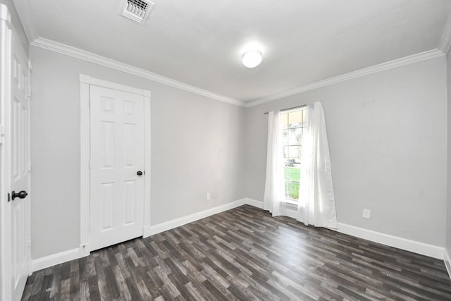 15030 Royal Shadows Dr, Houston, TX 77082 - unfurnished room featuring baseboards, visible vents, dark wood-style flooring, and crown molding