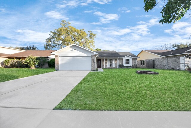 15030 Royal Shadows Dr, Houston, TX 77082 - ranch-style home featuring a front lawn, a garage, concrete driveway, and brick siding