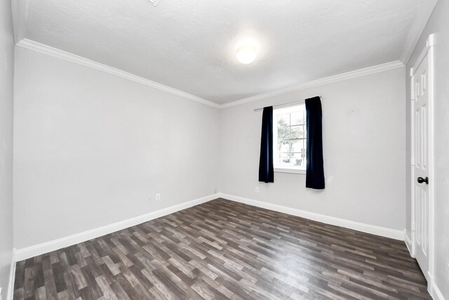 15030 Royal Shadows Dr, Houston, TX 77082 - spare room featuring crown molding, baseboards, and dark wood finished floors