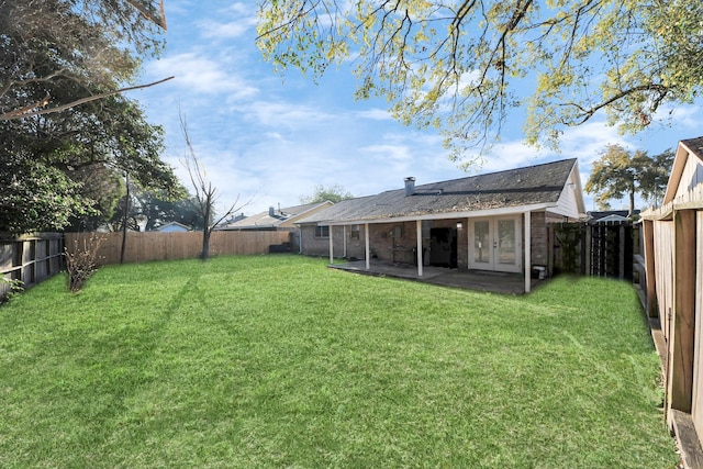 15030 Royal Shadows Dr, Houston, TX 77082 - view of yard featuring a patio, french doors, and a fenced backyard