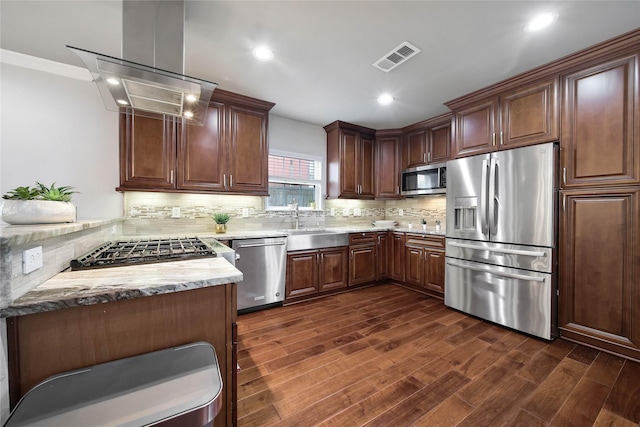 3327 Palm St, Houston, TX 77004 - kitchen featuring appliances with stainless steel finishes, a sink, dark wood finished floors, backsplash, and recessed lighting