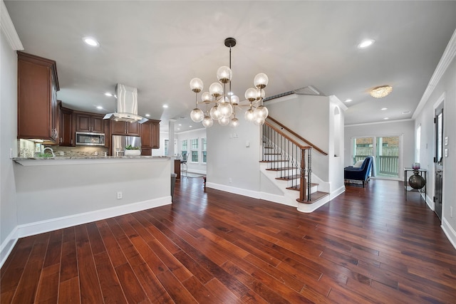 3327 Palm St, Houston, TX 77004 - kitchen featuring appliances with stainless steel finishes, crown molding, dark wood-style floors, recessed lighting, and open floor plan