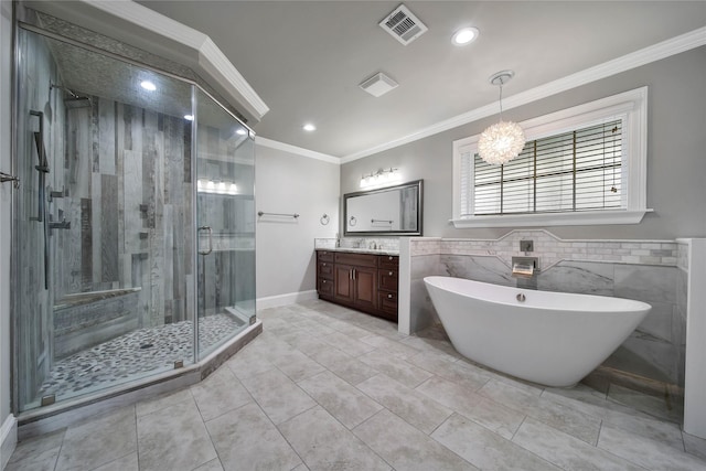 3327 Palm St, Houston, TX 77004 - full bath featuring ornamental molding, vanity, a stall shower, a freestanding tub, and a chandelier