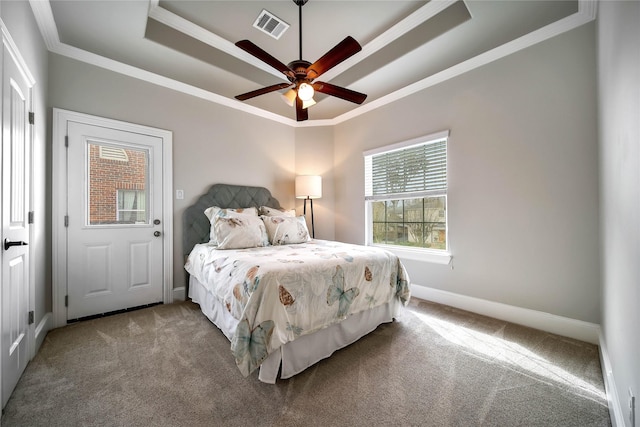 3327 Palm St, Houston, TX 77004 - carpeted bedroom featuring a raised ceiling, crown molding, baseboards, and ceiling fan
