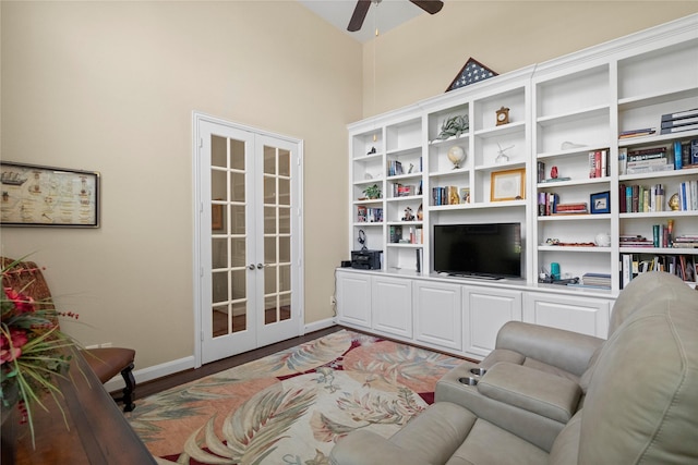 sitting room with baseboards, ceiling fan, french doors, and light wood finished floors