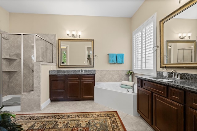 bathroom featuring a sink, a bath, tile patterned floors, and a shower stall