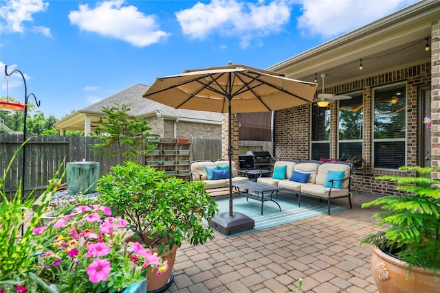 view of patio featuring an outdoor hangout area and fence