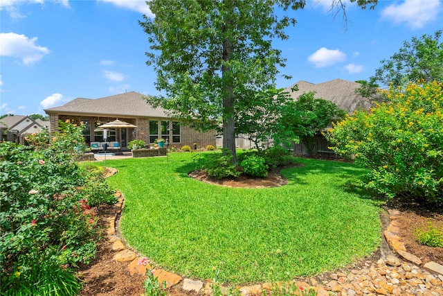 view of yard featuring a patio, fence, and an outdoor living space