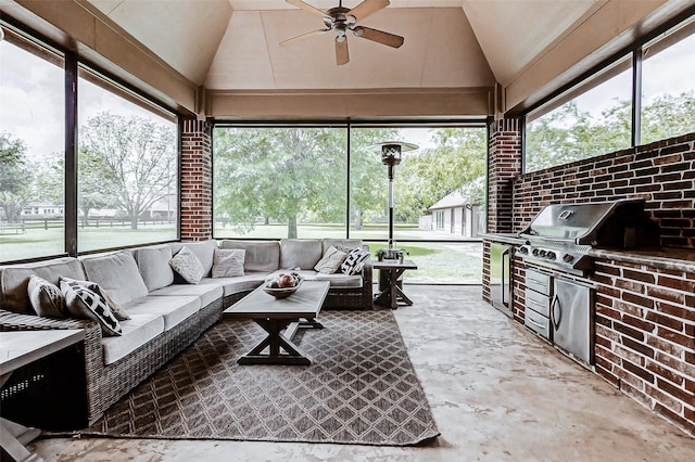 sunroom / solarium with outdoor lounge area, an outdoor kitchen, and ceiling fan