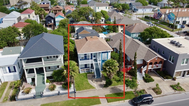 birds eye view of property with a residential view