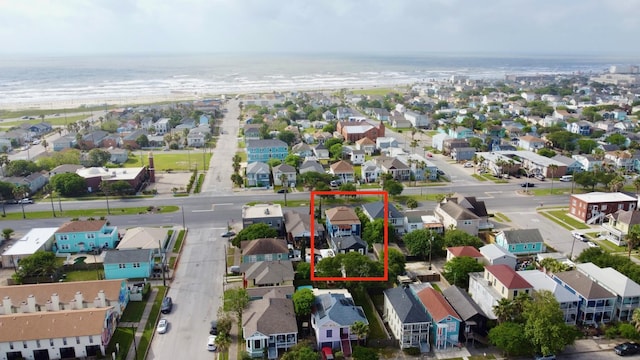 drone / aerial view with a water view and a residential view